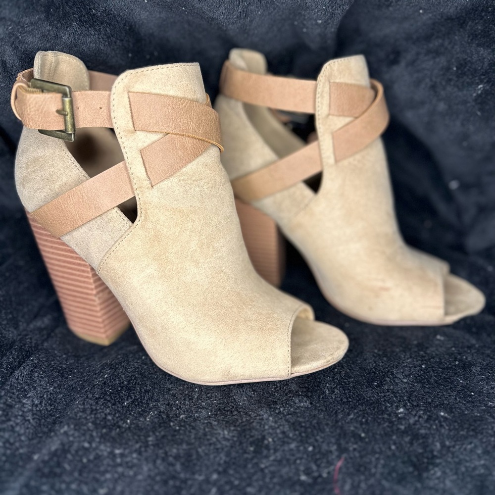 Peeptoe booties in tan color. Block heel, only worn a handful of times.